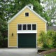 Yellow Siding With Green Garage