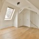 Empty Room with Skylight, Finished Natural Wood Floor