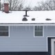 Winter,House,With,Icicle,And,Snow,On,The,Roof
